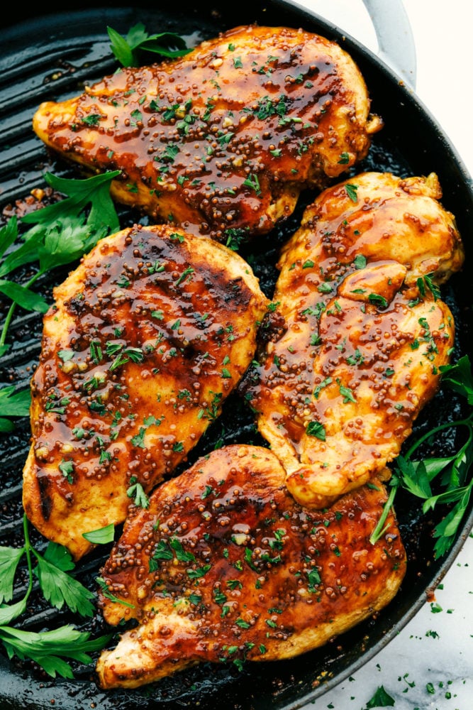 Grilled honey mustard chicken on grill. 