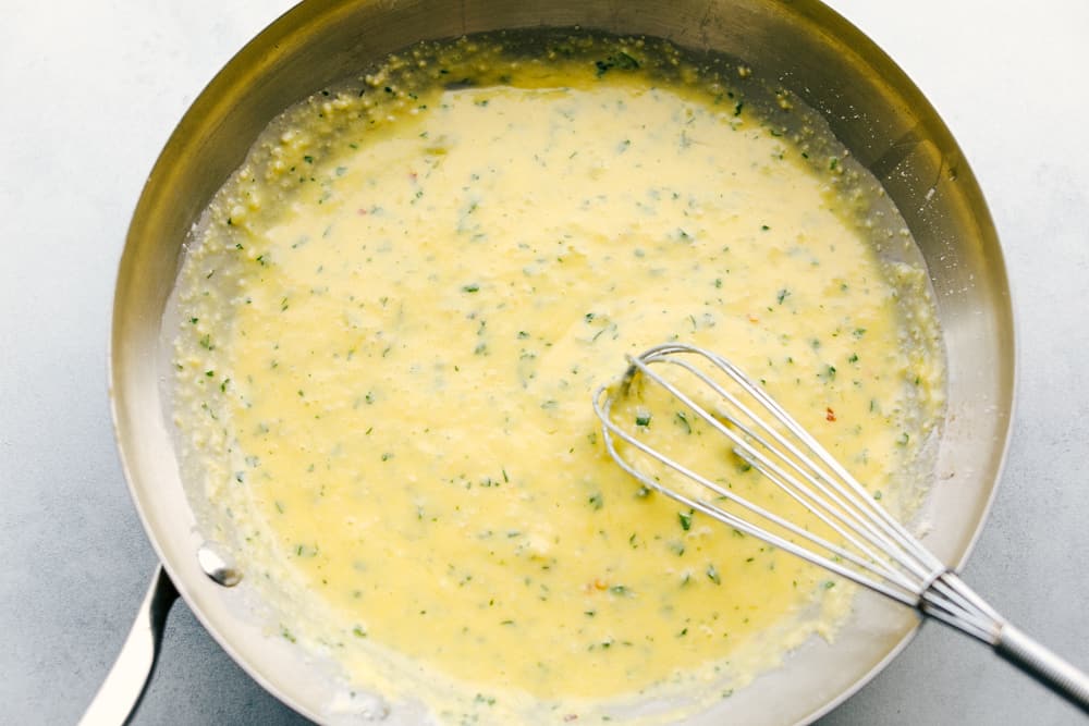 egg and seasoning cooking in a skillet