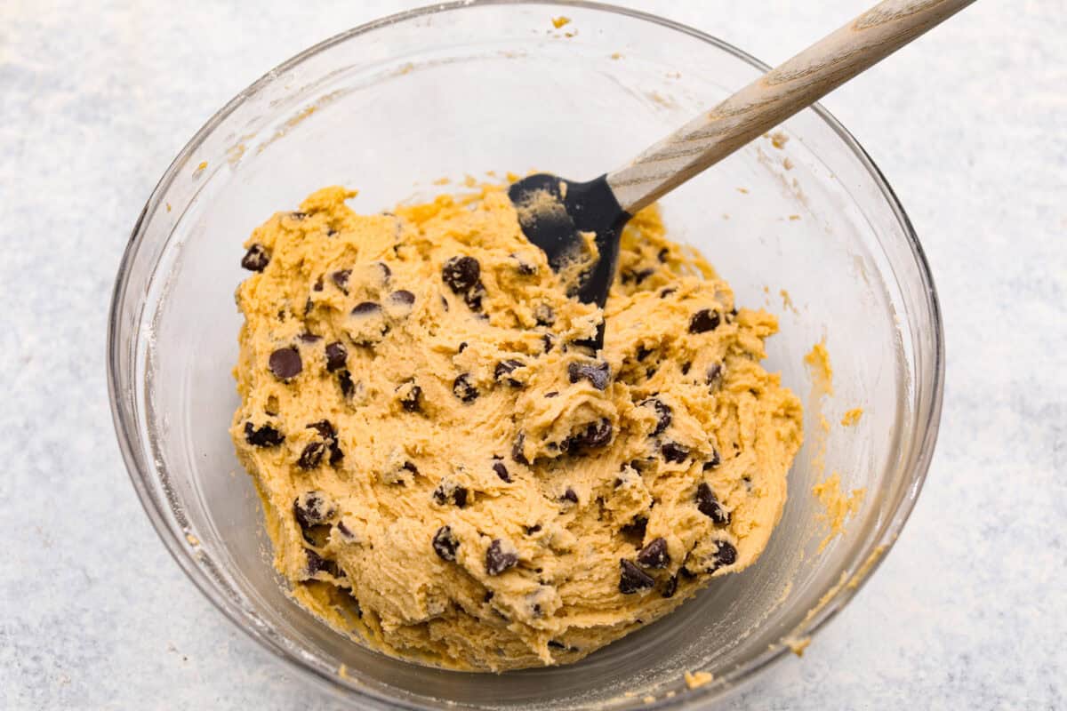 Overhead shot of brownie mixture with chocolate chips mixed in. 