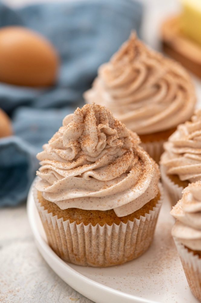 Churro cupcakes on a white plate. 