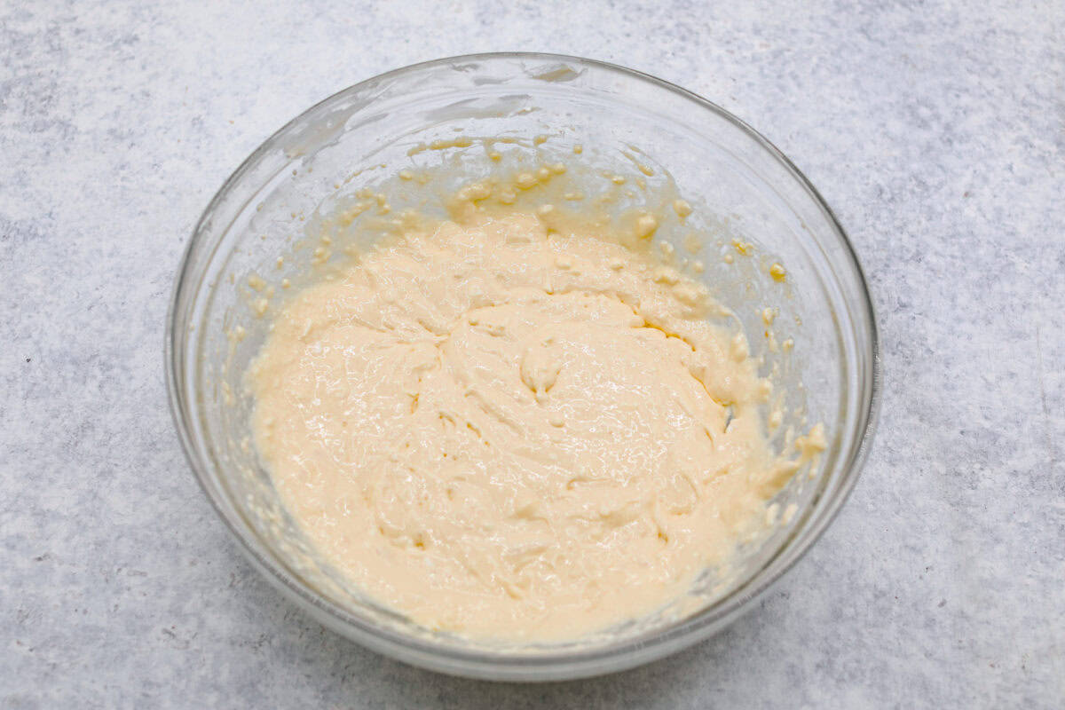 Overhead shot of cream cheese mixture in a glass bowl. 