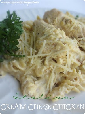 Italian cream cheese chicken on a white plate with green garnish.