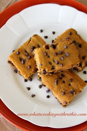 Skinny Pumpkin Bars on a roud white plate by whatscookingwithruthie.com