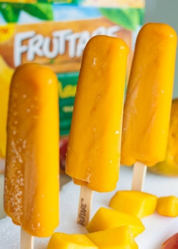 Three mango ice pops.