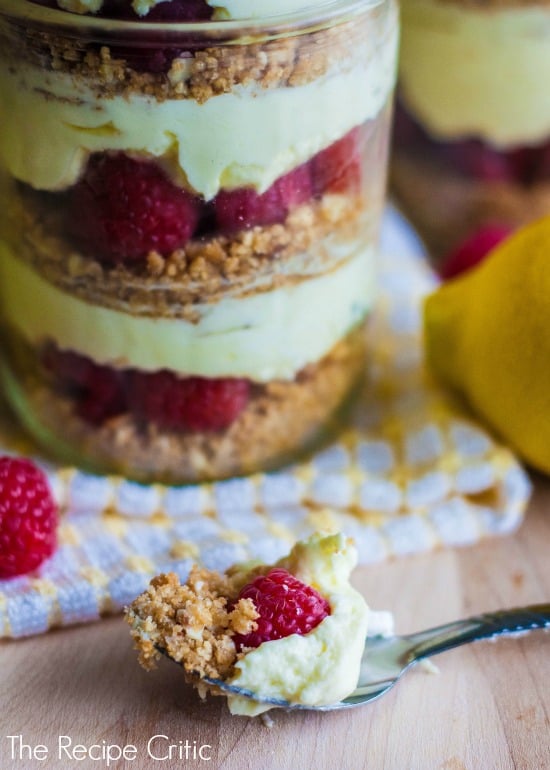 Layers of the raspberry parfait in a clear mason jar.