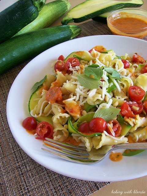 Garden Campanelle Salad with Fresh Tomato Basil Dressing on a white plate.