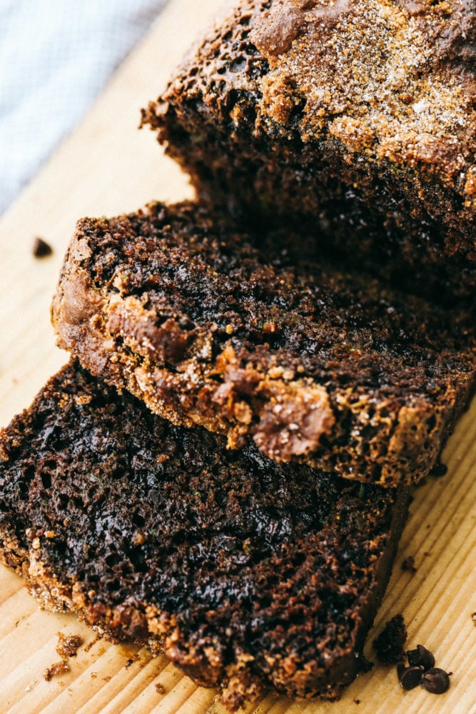 Chocolate zucchini bread sliced on a cutting board. 