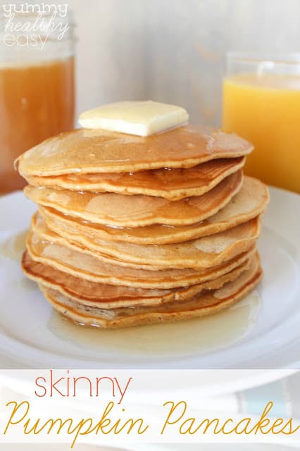 Stack of skinny pumpkin pancakes in a stack on a white plate.