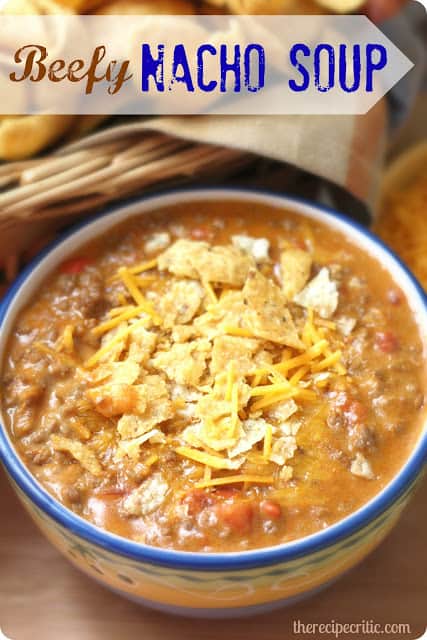 Beefy nacho soup in a blue and white bowl.