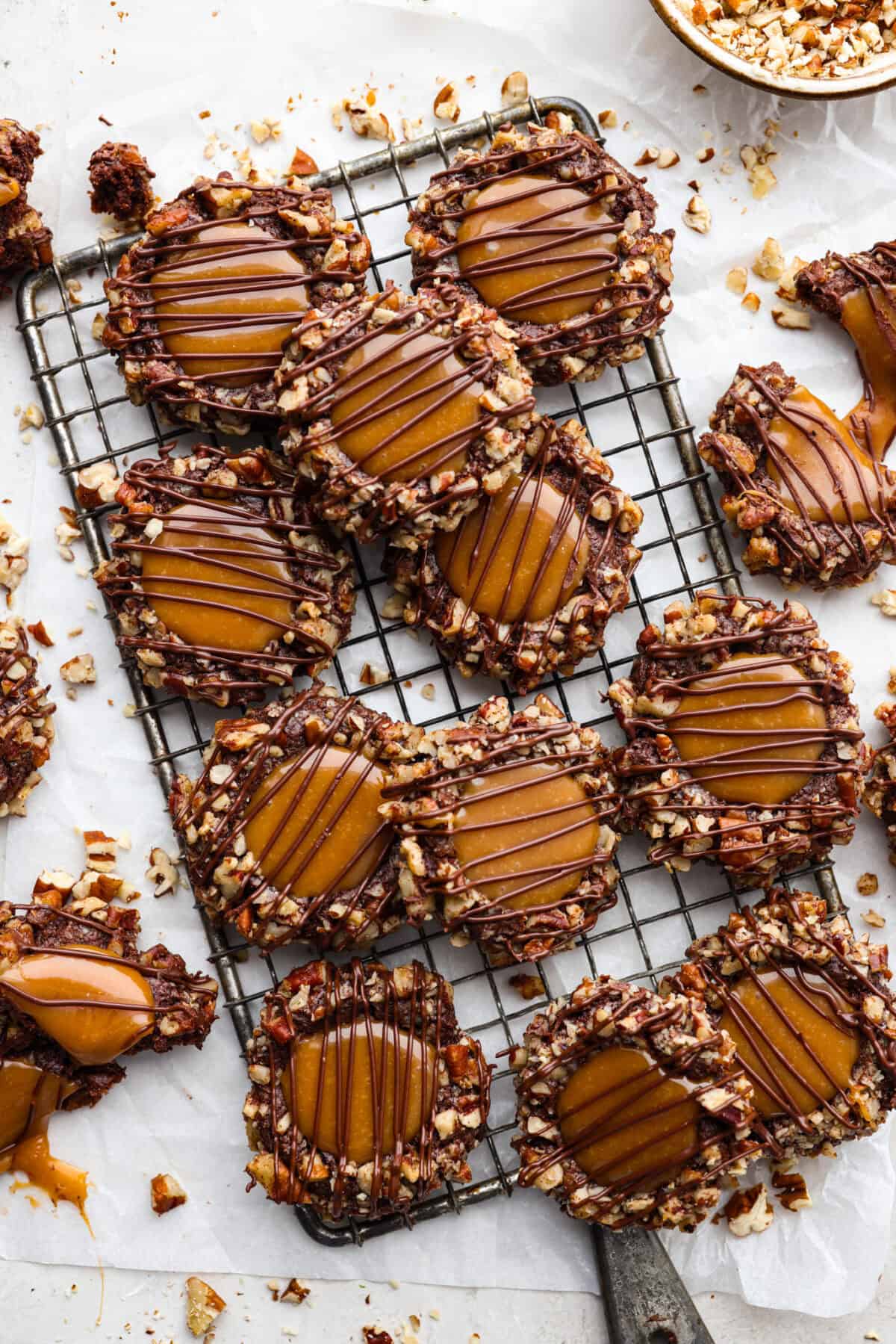 Overhead shot of turtle cookies on a cooling rack.