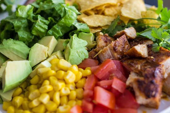 Close up photo of the ingredients of chicken taco salad. 