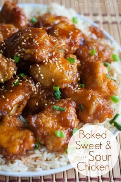 Baked Sweet and Sour Chicken over white rice on a white plate. 