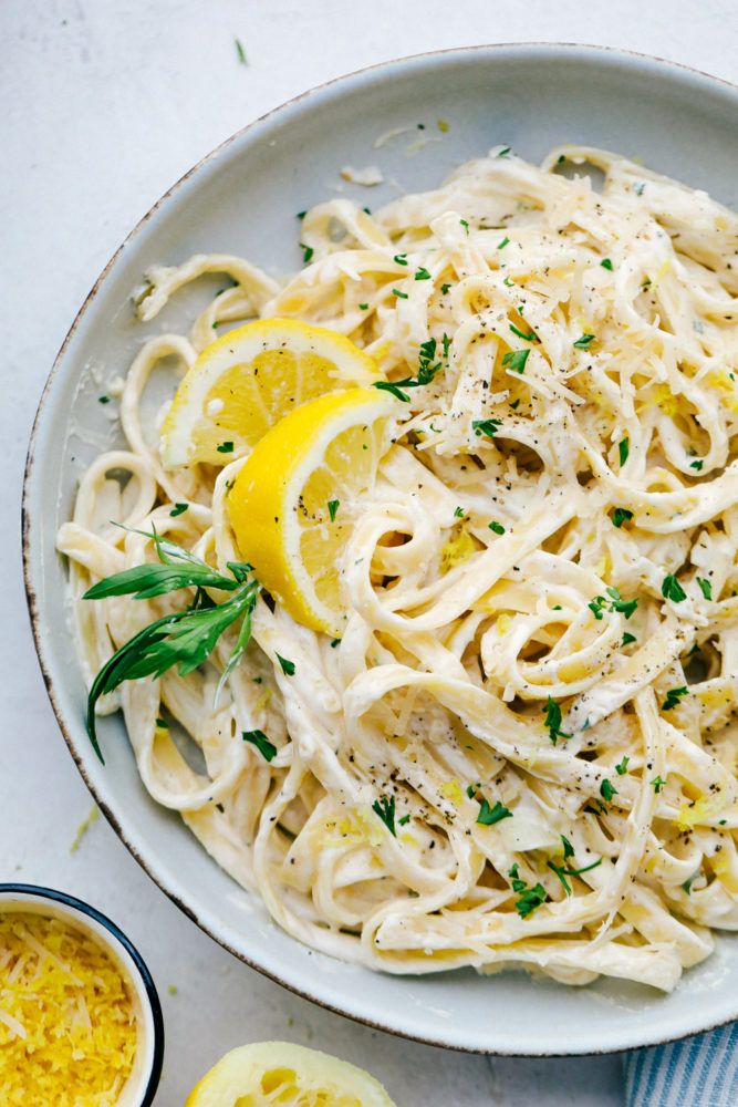 Lemon Garlic Cream Fettuccini on a white plate. 