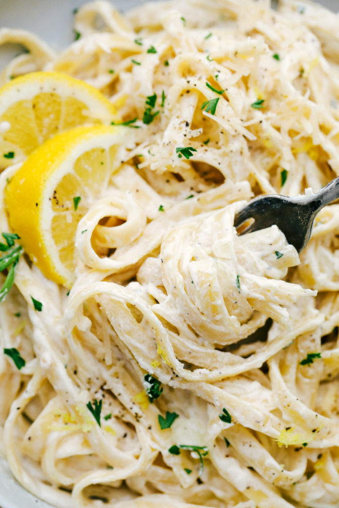 Close up of Lemon Garlic Cream Fettuccini with a fork removing some. 