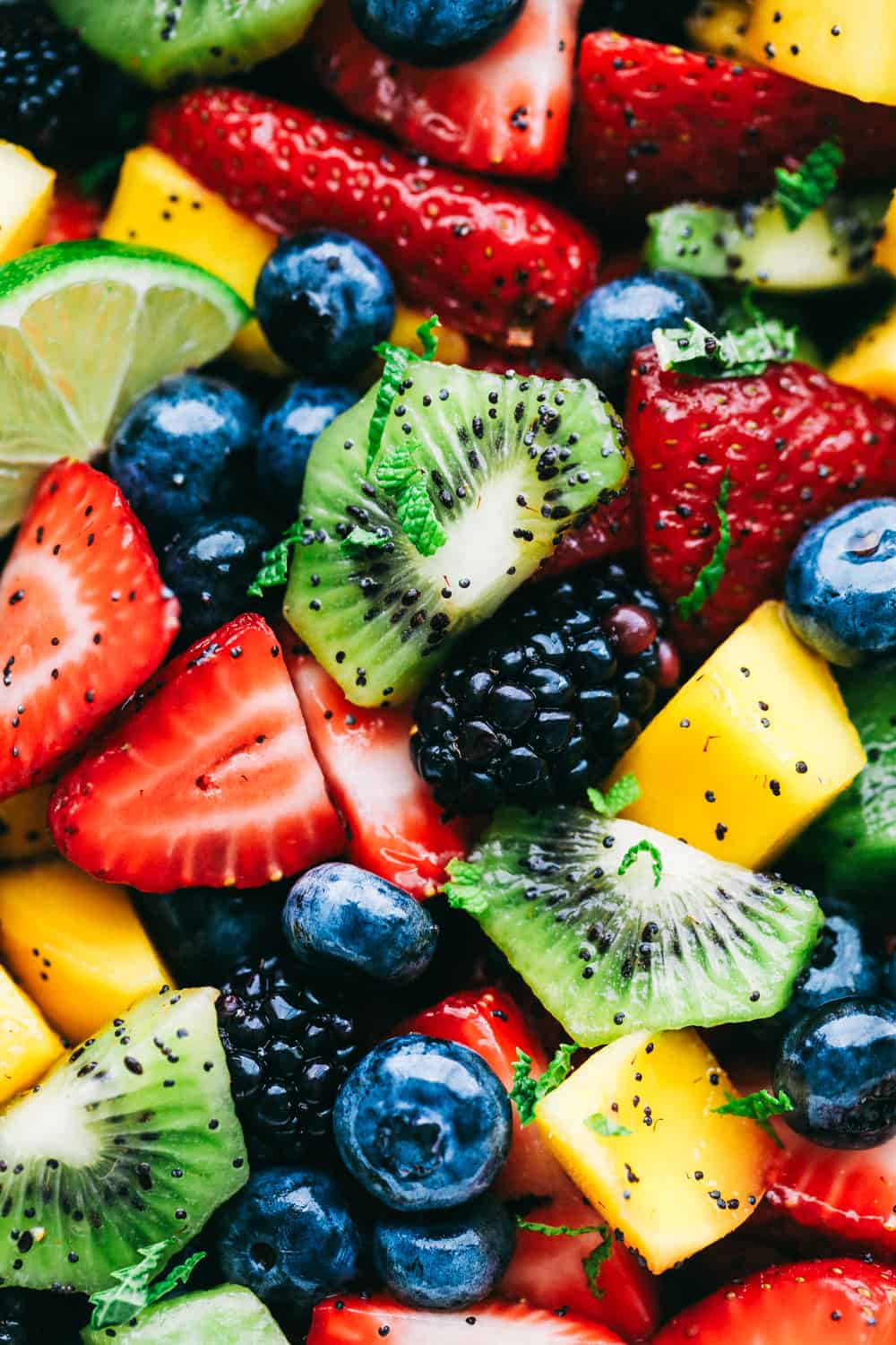 Close up on honey lime poppy seed fruit salad.