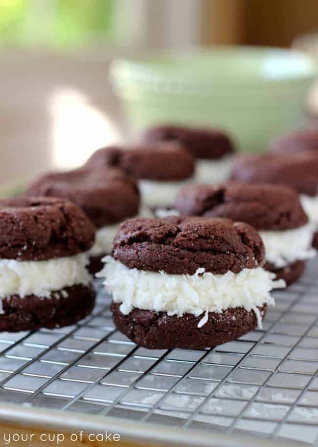 Chocolate Coconut Whoopie Pies on a cooling rack. 