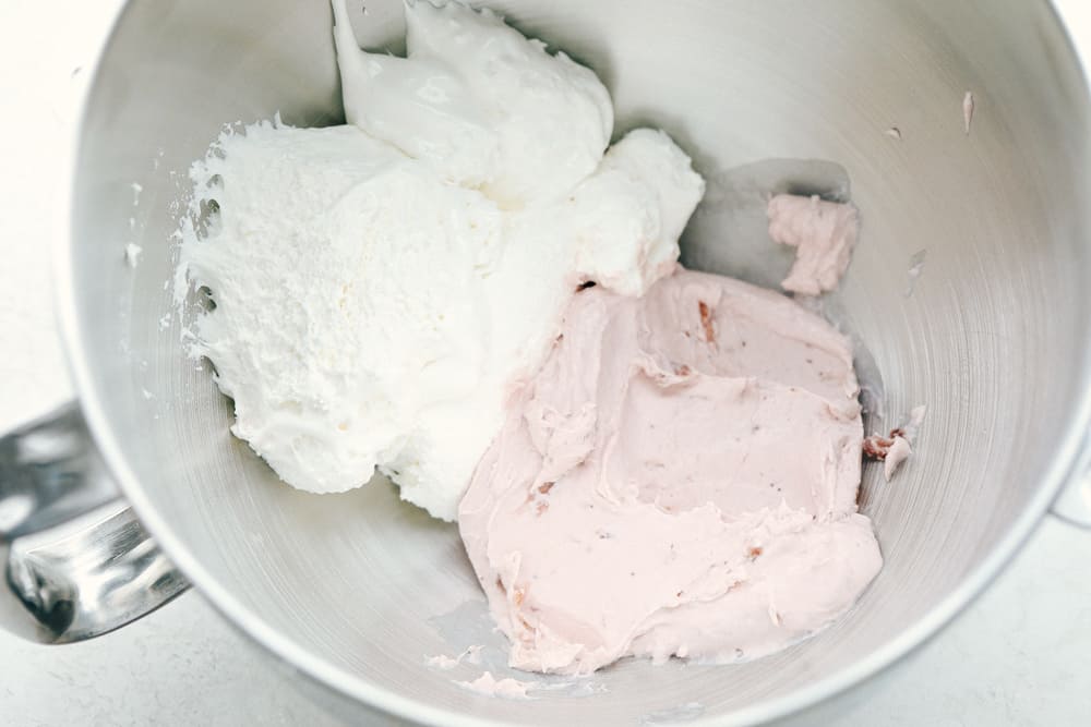 The ingredients of Strawberry Cream Cheese Fruit Dip in a KitchenAid mixing bowl. 