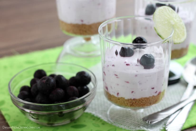 Blueberry Lime No-Bake Cheesecake Cup with a cup of fresh blueberries on the side. 