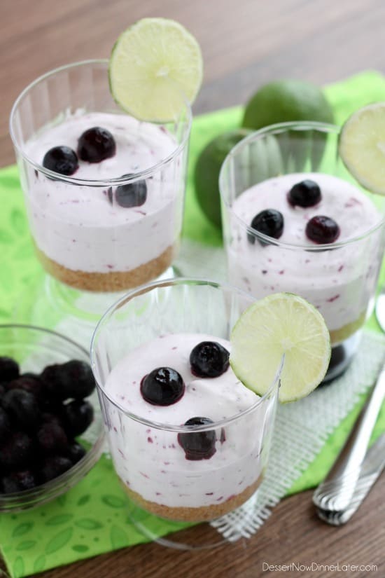 Blueberry Lime No-Bake Cheesecake Cups with fresh lemon and blueberries on the side. 