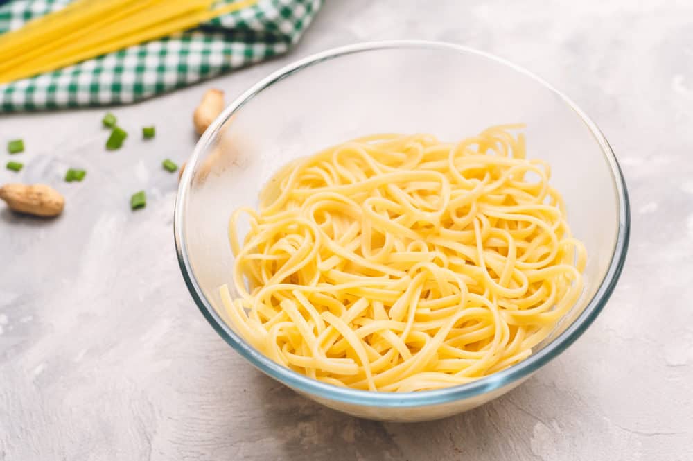 Cooked linguine in a glass bowl. 