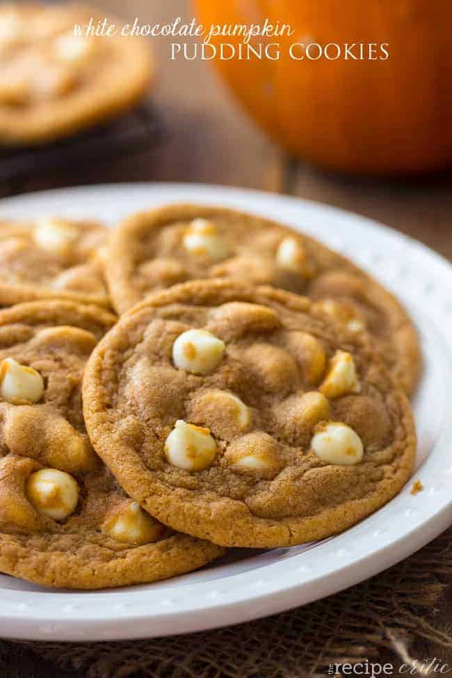 White chocolate pumpkin pudding cookies on a white plate. 