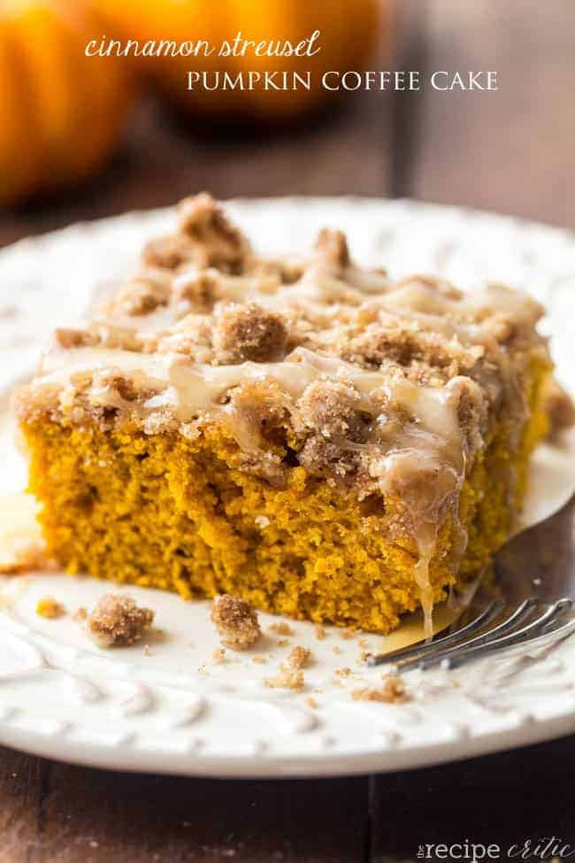 Cinnamon streusel pumpkin coffee cake on a white plate with a fork on the side. 