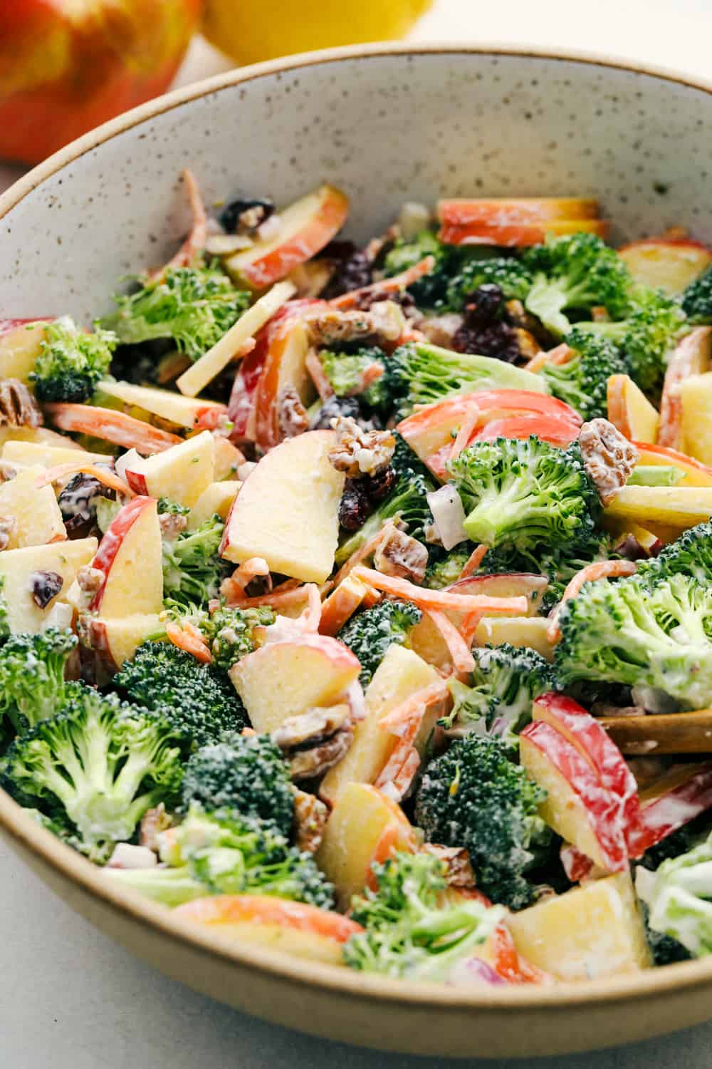 Broccoli apple salad with a tangy dressing in a bowl ready to eat. 