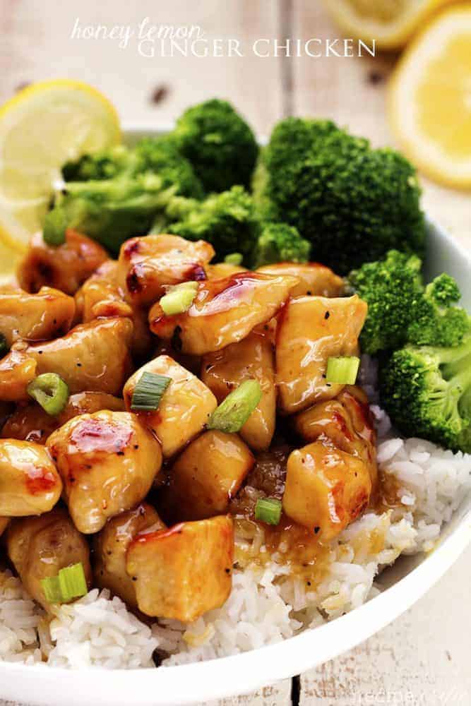 honey lemon ginger chicken with rice and broccoli in a white bowl.