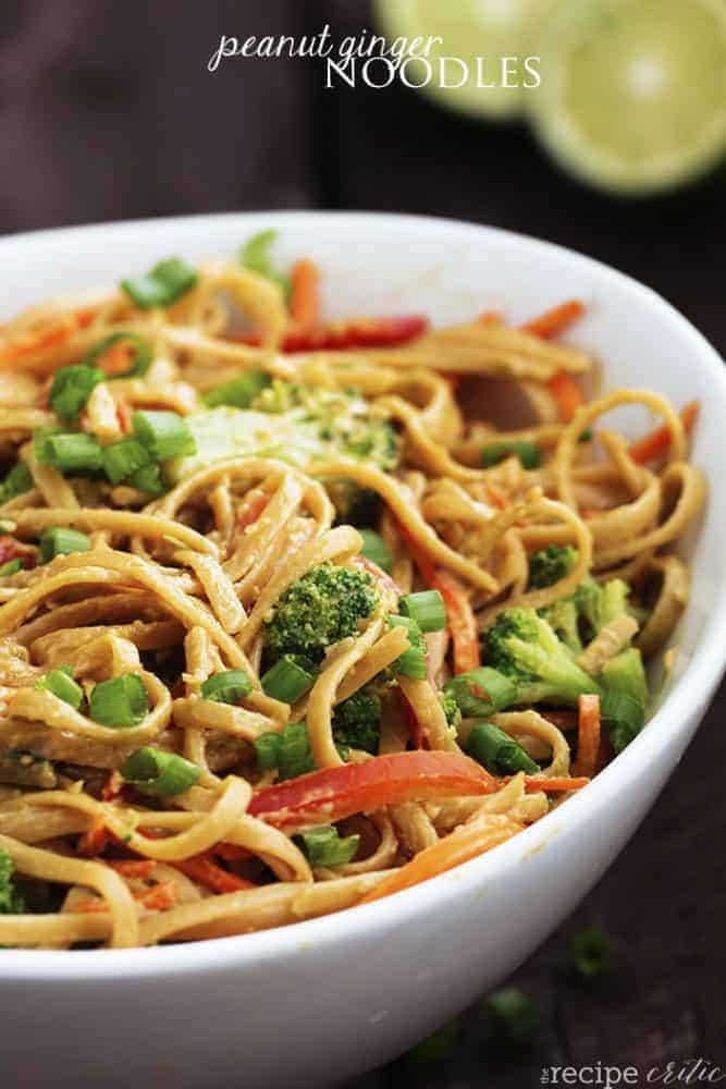 Peanut ginger noodles in a large white bowl.