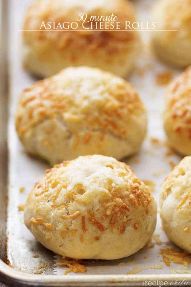 asiago cheese rolls on a baking tray.