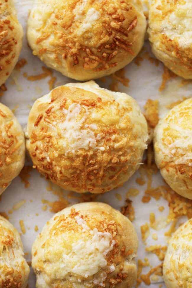 asiago cheese rolls fresh out of the oven on a sheet pan.