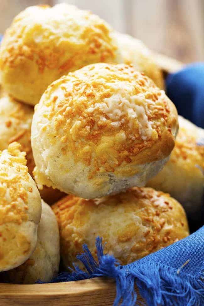 asiago cheese rolls in a basket ready to be served.