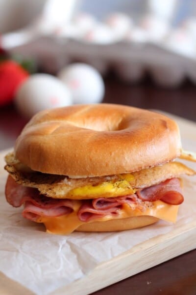 bagel breakfast sandwich on a white paper.