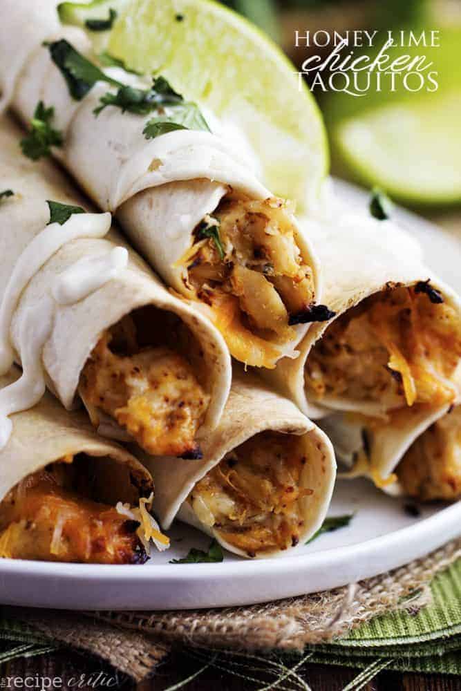 honey Lime chicken taquitos in a stack on a white plate.