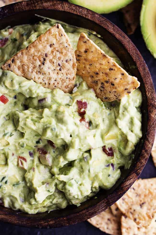 ranch guacamole in a bowl with 2 tortilla chips.