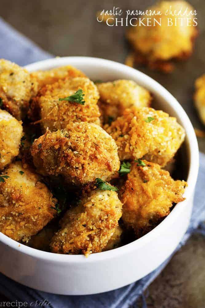 garlic parmesan cheddar chicken bites in a white bowl.