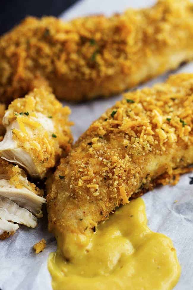 garlic cheddar chicken strips dipped in honey mustard.