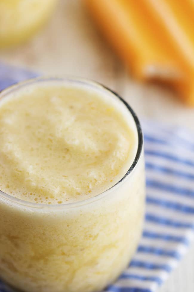 close up of an orange creamsicle in a glass. 