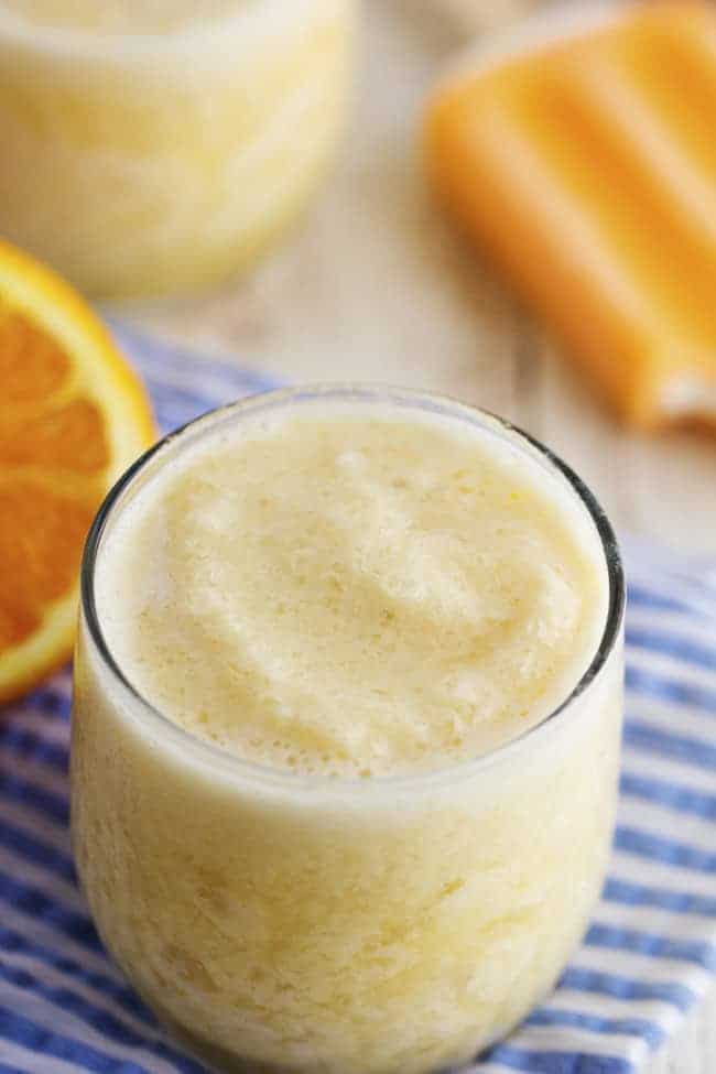 orange creamsicle smoothie in a glass.