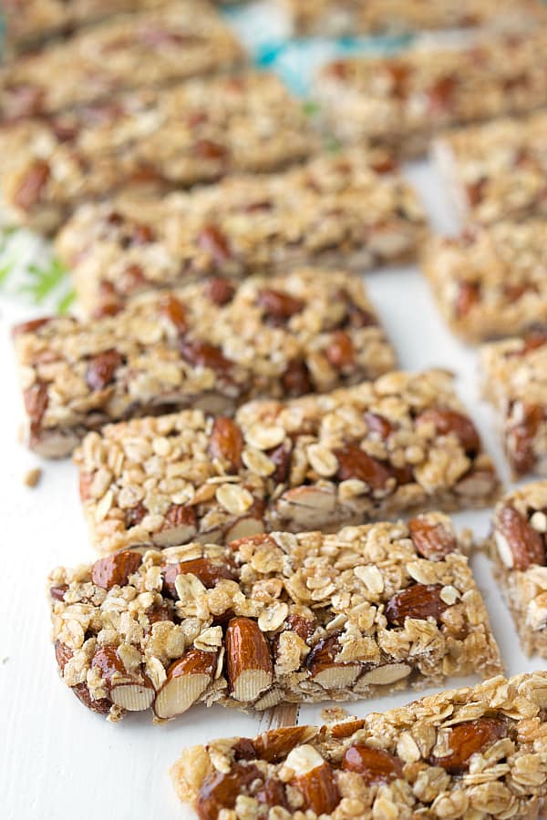 Almond granola bars laid in a row.