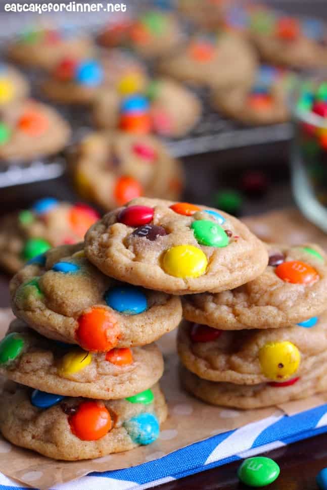 Side view of a stack of brown Butter M&M Cookies.