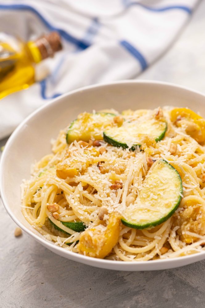 Summer squash lemon spaghetti in a white bowl.