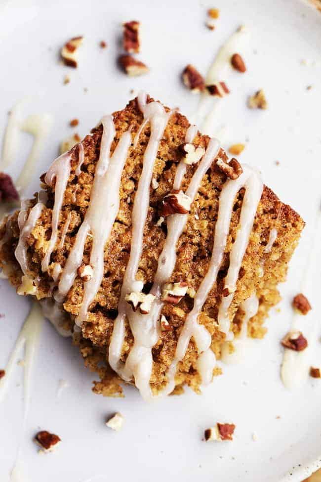 Areal view of a baked cinnamon roll oatmeal on a white plate.