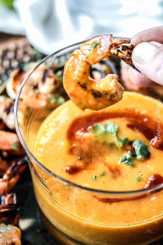 Dipping Coconut Honey Lime Shrimp into Mango Dip.