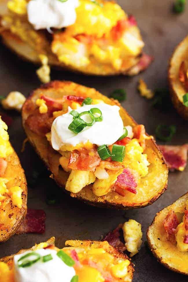 potato skins close up view with sour cream and chives.