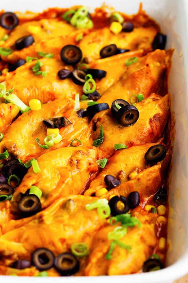 Three cheese mexican shells in a white baking dish.