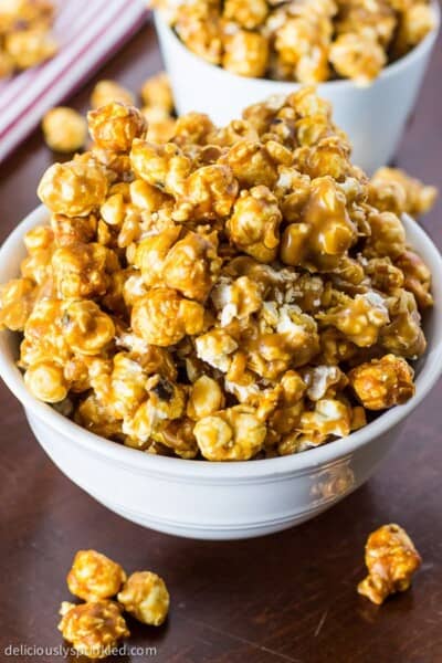 Oven Baked Caramel Corn in a white bowl.