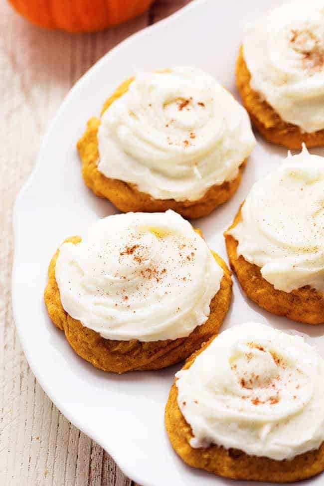 pumpkin cookies on a white plate.