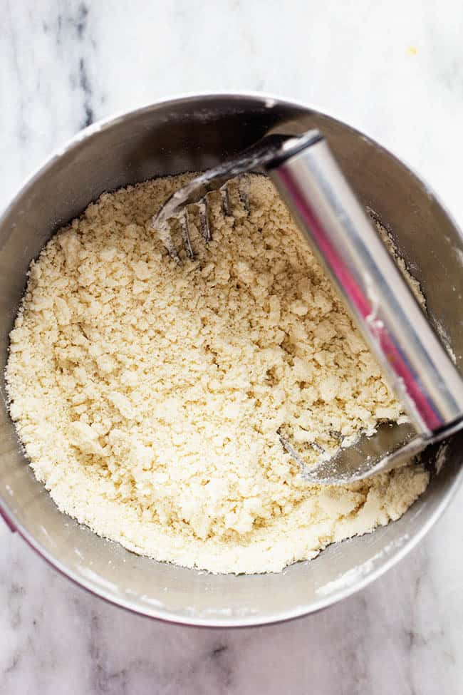 Using a pastry blender to cut ingredients.