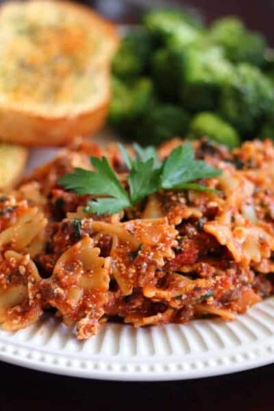 Bow tie pasta on a white plate.